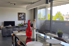 Schitterende loft met gratis parking, vlakbij Antwerpen